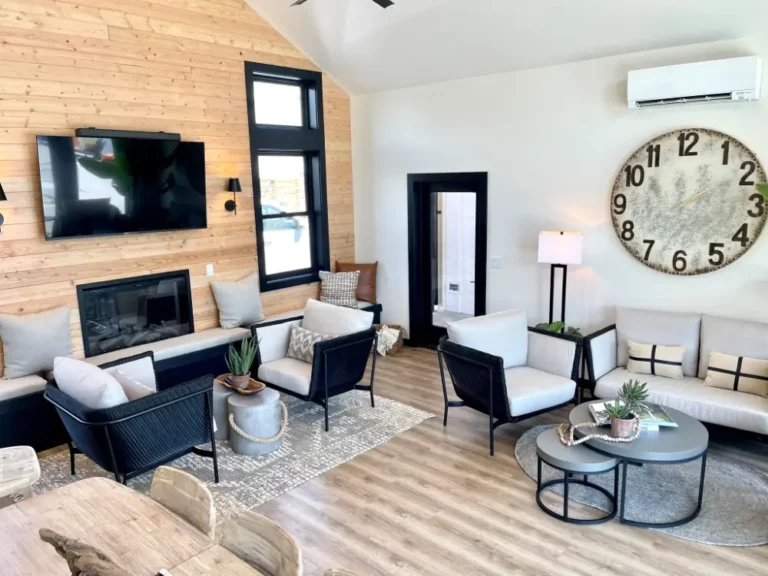 Living room in Ponderosa 4A with a fireplace and lake-view windows